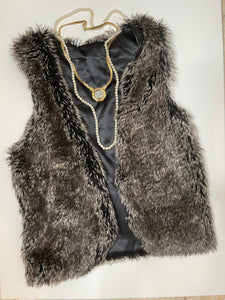 There’s no age for glamorous..  Kid faux vest size 10